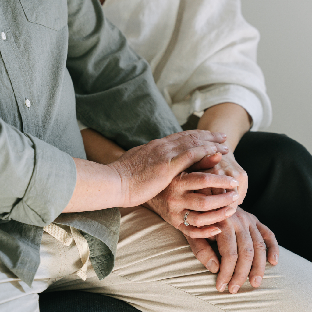 About Us older people holding hands - Person centred approach