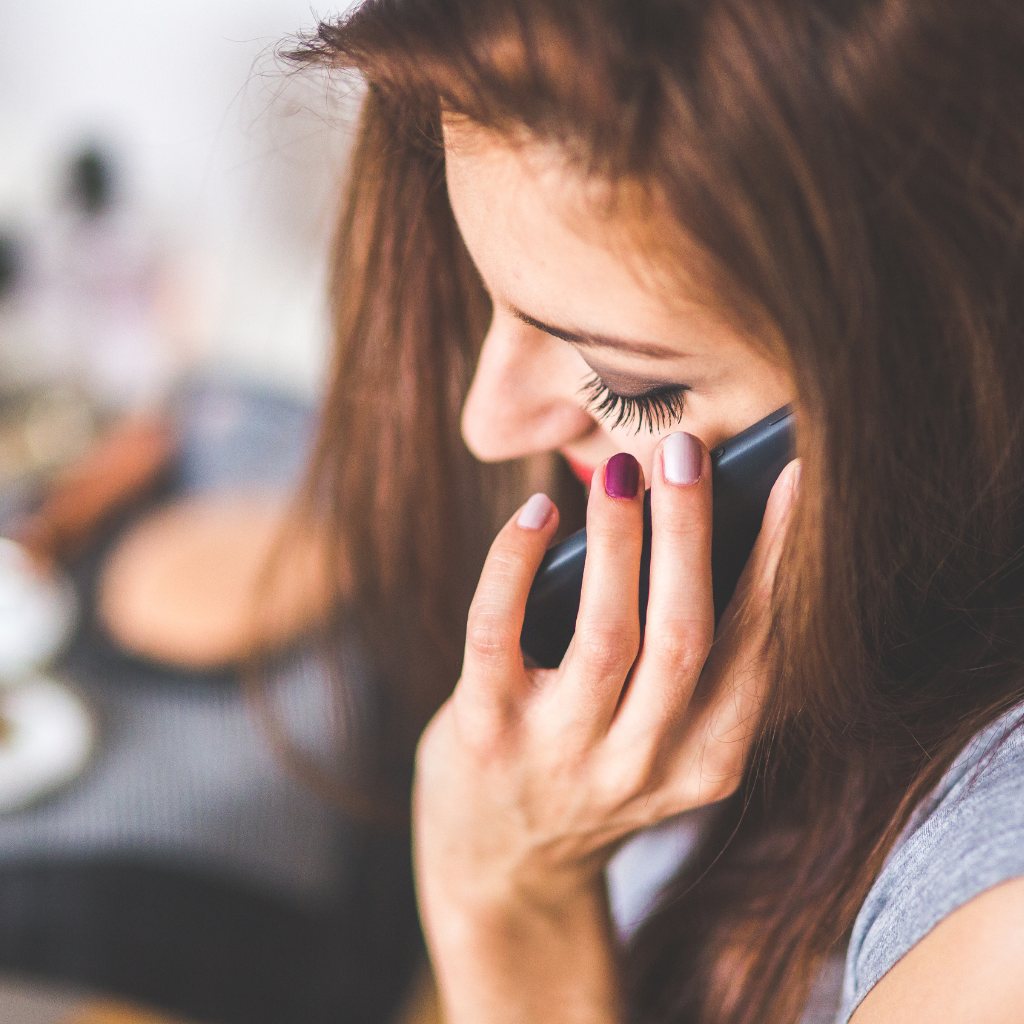 A lady, woman on the phone making contact
